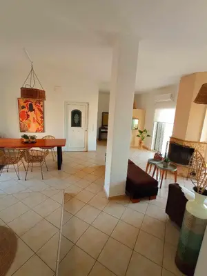 a living room with a couch and a table at Sonema Seaside Apt in Chania Town