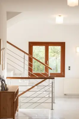 a staircase in a white room with a window at Fleur du sud - Villa in Chania in Korakiaí