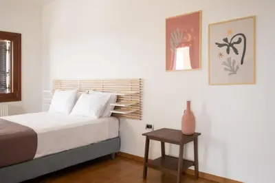 a bedroom with a bed and a side table at Fleur du sud - Villa in Chania in Korakiaí