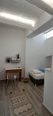 a room with a desk and a bed and a desk sidx sidx sidx at MariAdni Garden House in Kissamos