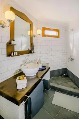 a bathroom with a sink and a mirror at Nature stone retreat between Balos & Elafonisi beach, contactless check-in, Mouri Nature House in Mouríon