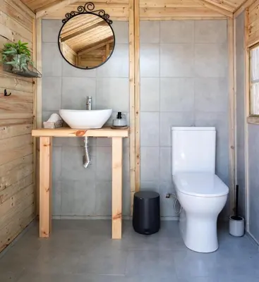 a bathroom with a sink and a toilet at Falasarna Caravans in Falasarna