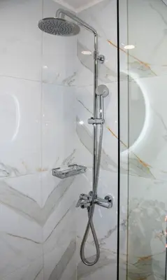 a shower with a glass door in a bathroom at Iasmos in Sfakiá