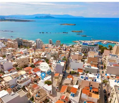 an aerial view of a city and the ocean at SugarDustApt Elegant Retreat 150m from the Sea in Chania Town