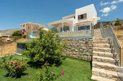 a house with a stone staircase in a yard at Villa Alia in Sfakiá