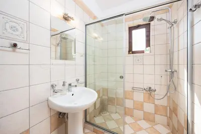 a bathroom with a sink and a shower at Villa Pasiphae 1 in Stalos