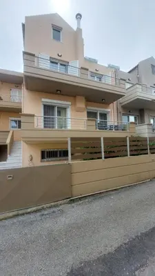 a building with a fence in front of it at Ammos Family Villa in Daratso