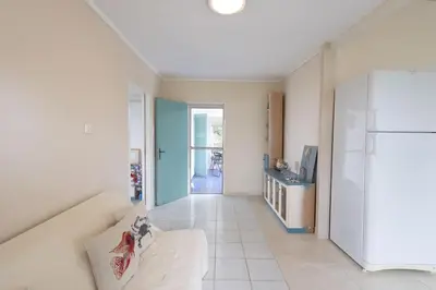 a living room with a couch and a refrigerator at Rastoni - Beach Family House in Chorafakia