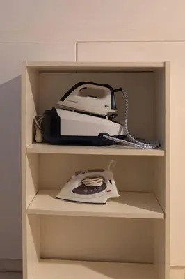 a cabinet with a phone and a fax at Maisonette with Exclusive Private Parking in Chania Town