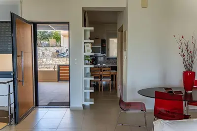a kitchen and dining room with a table and chairs at Maisonette with Exclusive Private Parking in Chania Town