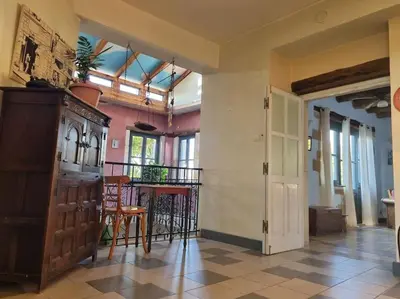 a large room with a table and chairs and a balcony at KerAsh Villa Drapanias in Kissamos