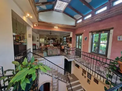 a large room with a staircase in a house at KerAsh Villa Drapanias in Kissamos