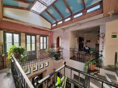 a large room with a balcony with plants at KerAsh Villa Drapanias in Kissamos