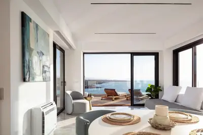 a living room with a couch and a table at Casablanca Villa in Chania Town