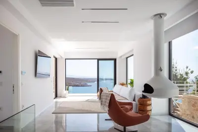 a living room with a couch and a table at Casablanca Villa in Chania Town