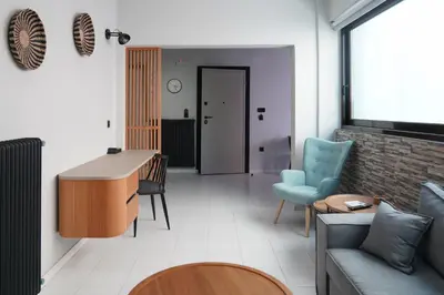 a living room with a couch and a table at Dedalos City Apartment in Chania Town