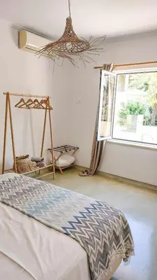 a bedroom with a bed and a window at Seamoon in Plataniás