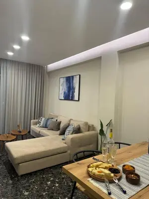 a living room with a couch and a table at Catherine Apartment in Chania Town
