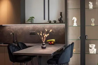 a dining room table with chairs and a banana on it at Celestial Apartments in Chania Town