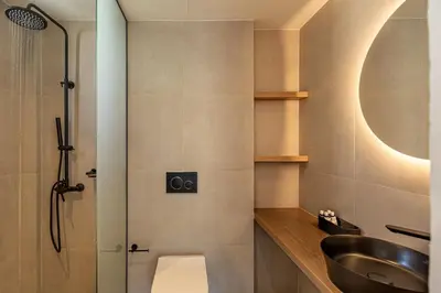 a bathroom with a sink and a shower at Aurora By Anasa in Palaiochóra