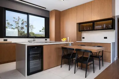 a kitchen with a table and a table and chairs at Kiyomi Villa in Chania Town