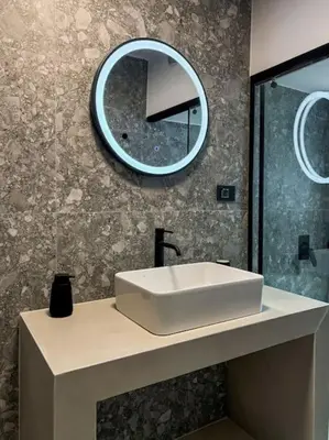 a bathroom with a white sink and a mirror at Casa in giardino in Chania Town