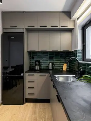 a kitchen with a sink and a counter top at Casa in giardino in Chania Town