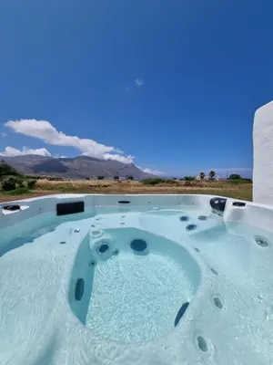 a jacuzzi tub with a view of the desert at All Season Lovely Seafront Cottage in Kissamos