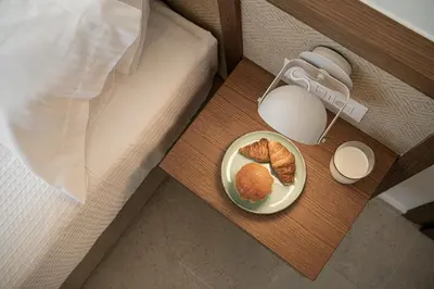 a plate of food on a table next to a bed at Villa Seyian in Chania Town