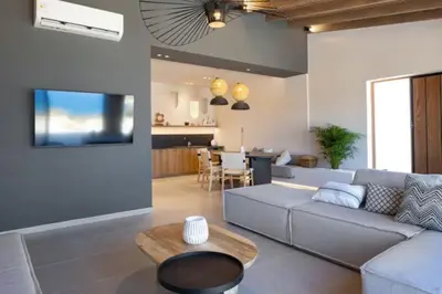 a living room with a couch and a table at Yemaya Sea View Villa in Chania Town