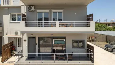 a view of a house with a balcony at Lumina Apartment with Shared Pool in Perivólia