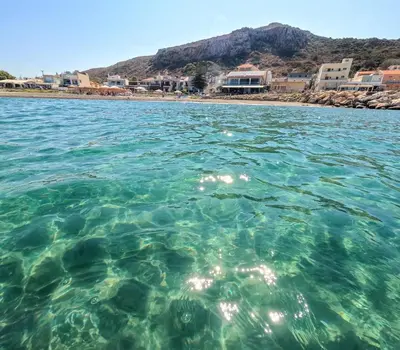 a view of a beach from the water at Rodi Apartment in Kolymvari