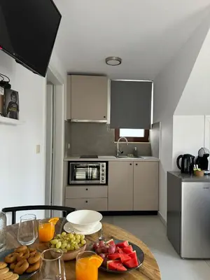 a kitchen with a table with fruit on it at Kasteli Apartment in Kissamos