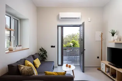a living room with a couch and a table at Centrale Apartment Chania in Chania Town