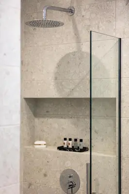 a shower with a glass door in a bathroom at Centrale Apartment Chania in Chania Town