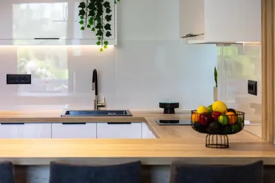 a kitchen with a bowl of fruit on a counter at Centrale Apartment Chania in Chania Town