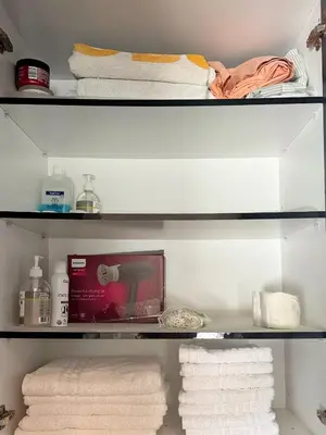 a closet with towels and a shelf with towels at Lia cozy apartment in Chania Town