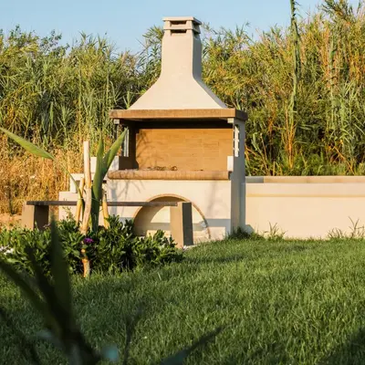 a bird house in a yard with grass at Welcome U in Gerani Chanion