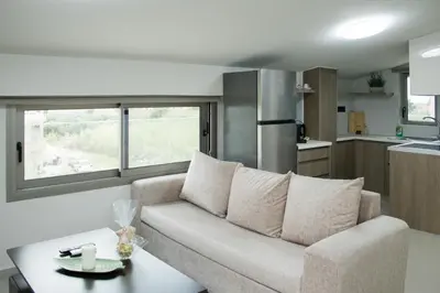 a living room with a couch and a table at Welcome U in Gerani Chanion