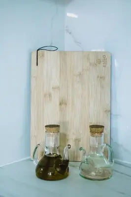 two glass siphons sitting on a table next to a wooden board at Welcome U in Gerani Chanion