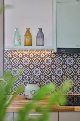 a kitchen with a toaster and vases on a wall at Mantis' House in Chania Town
