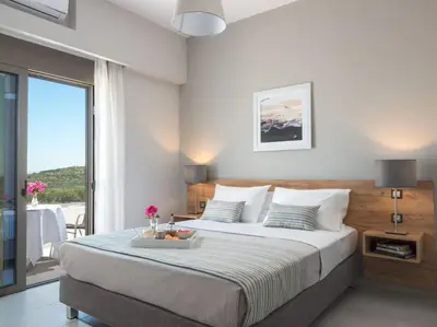 a bedroom with a bed with a tray of flowers on it at Panoramic view villa - Selita in Tavronitis