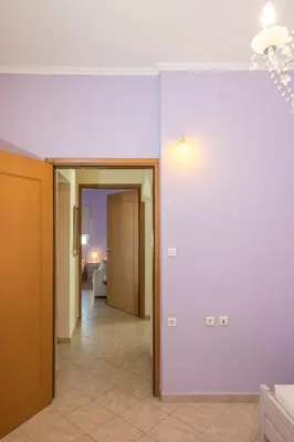 an empty room with a hallway and a room with at Kaloudis Apartment in Kissamos