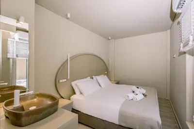 a bedroom with a bed and a bath tub at Nidra Studio with private pool in Chania Town
