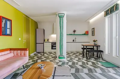 a living room with a couch and a table at 8 Min walk to Harbour in Chania Town