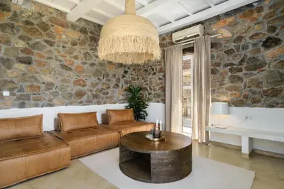 a living room with a couch and a table at Newly Renovated villa Artemis with Private Pool just 20min from Elafonissi in Livadia
