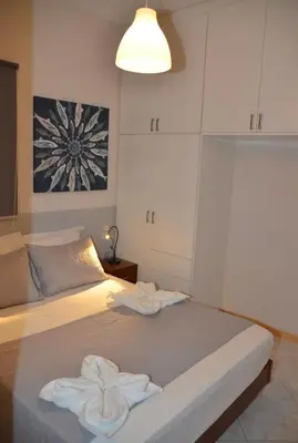 a bedroom with a bed with towels on it at Vaso's comfort apartment 1 in Chania Town