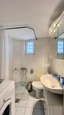 a white bathroom with a sink and a toilet at Angie A2 close to the beach by 8essentially in Chania Town