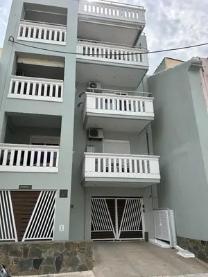 a building with white balconies on the side of it at Koum Kapi Mare Studios C2 in Chania Town
