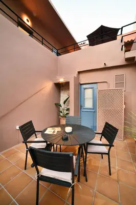 a dining room with a table and chairs at Casa Kâllisti Grande in Chania Town